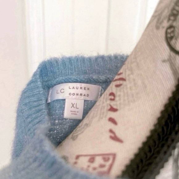 NWT Lauren Conrad. Blue Sky Knit Ruffled Shoulders Lite Weight Sweater.
Size XL - Picture 3 of 3